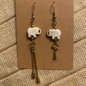 One of a kind handmade mismatch elephant earrings made from upcycled parts.
